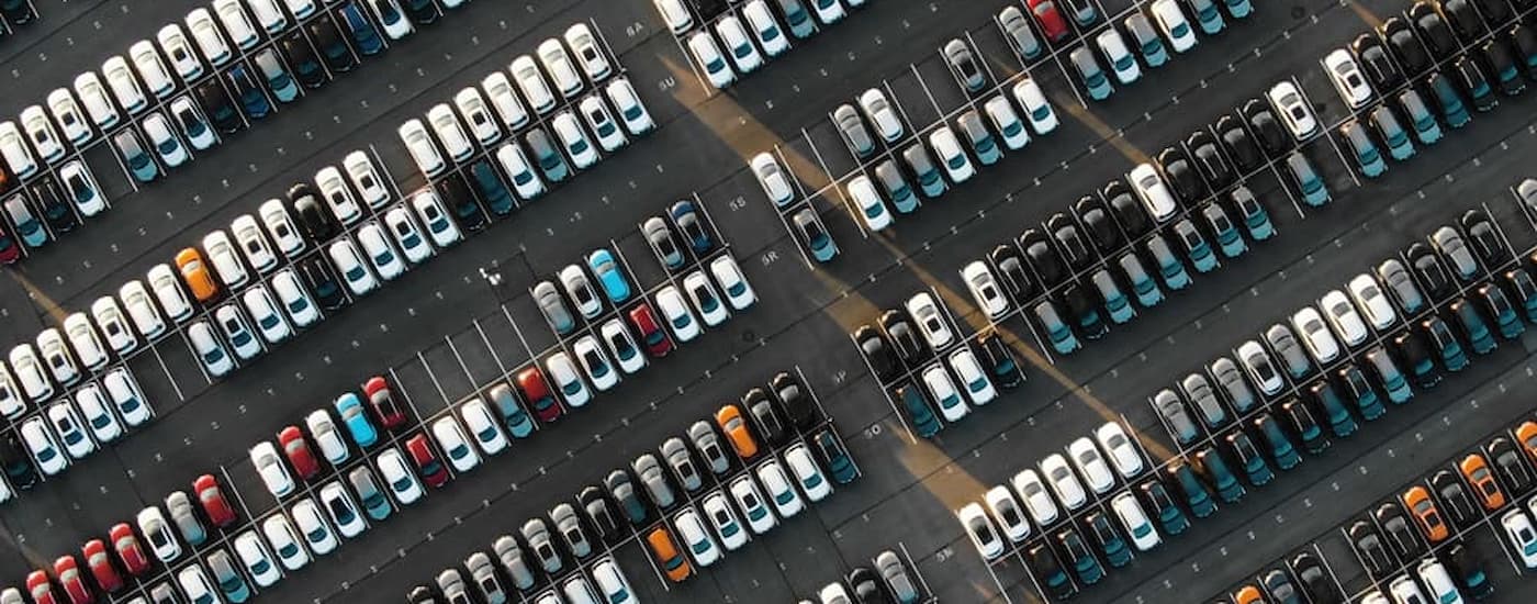 A used car lot is shown from a high angle.